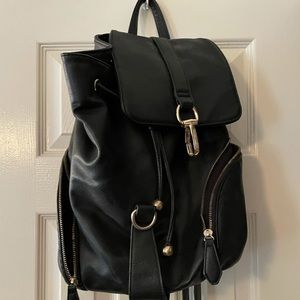 Black leather backpack in good condition. Multiple pockets and zippers.